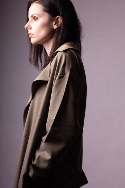 beautiful young girl in trench coat - Photo, Image
