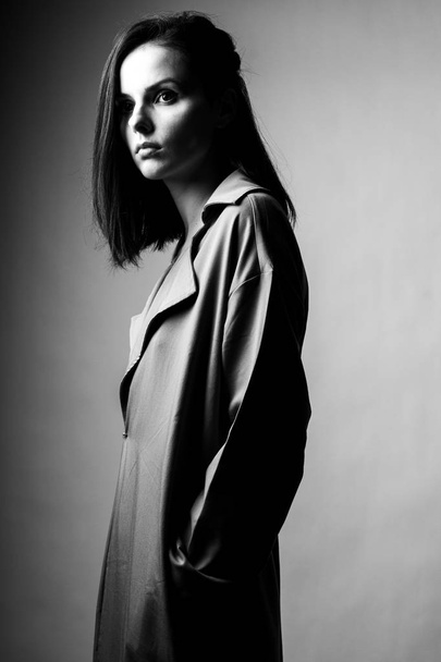 beautiful young girl in trench coat - Valokuva, kuva