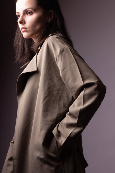 beautiful young girl in trench coat - Photo, image