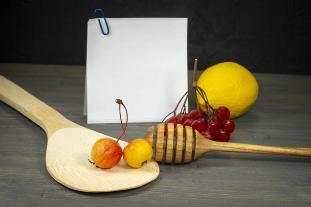 Still life with apples, berries and honey wand - Photo, Image