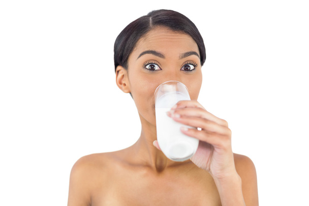 Smiling attractive model drinking milk - Zdjęcie, obraz
