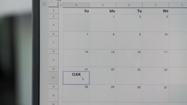 Schrijven Schoonmaakdag op 21ste op kalender om deze datum te onthouden. - Video