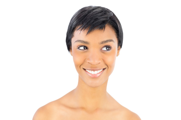 Cheerful black haired woman posing looking away - Фото, зображення