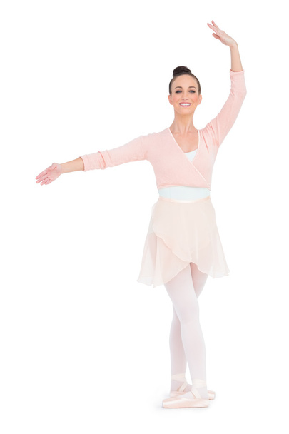 Happy gorgeous ballerina standing in a pose - Zdjęcie, obraz