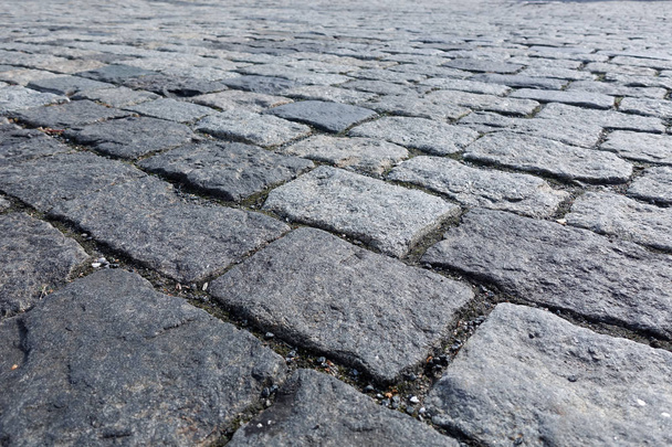 Large stones of a cobblestone paved bridge. Close-up - Photo, Image