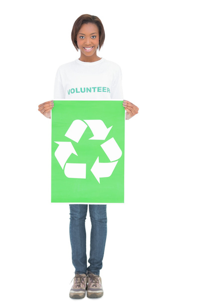Smiling volunteer woman holding recycling sign - Foto, Bild