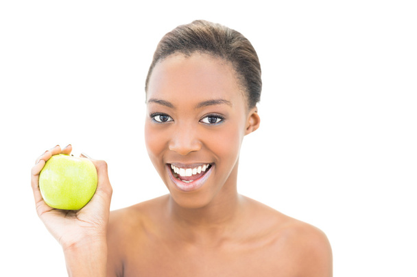 Smiling beauty holding green apple - Фото, изображение