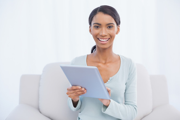Smiling attractive woman using her digital tablet - Φωτογραφία, εικόνα