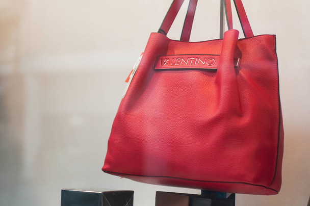 Valentino leather handbag in a luxury fashion store showroom - Photo, Image