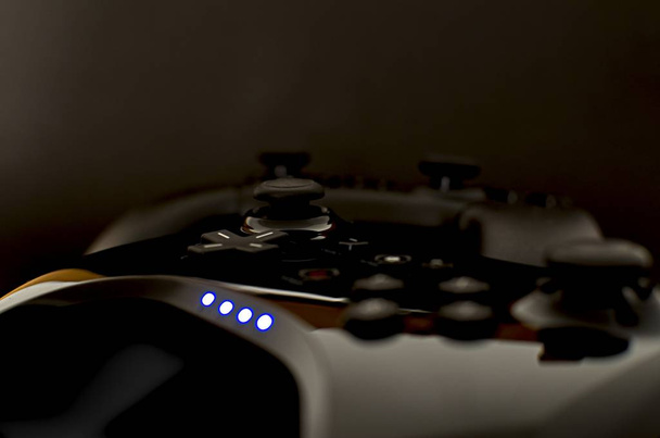 Чорні бездротові ігрові контролери на чорному тлі з сильним дефокусом
 - Фото, зображення