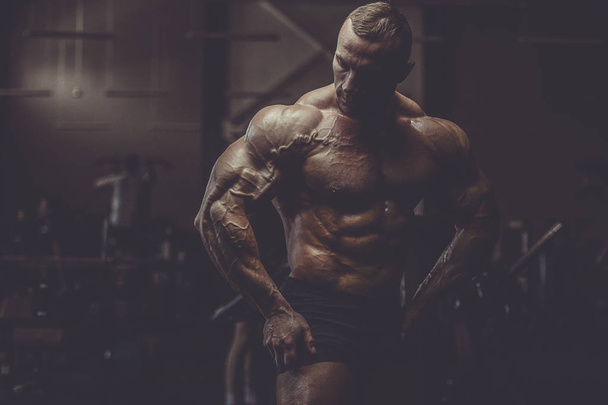 Brutal strong athletic men muscles workout bodybuilding muscular - Fotoğraf, Görsel