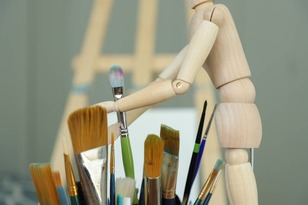 Closeup of painting brushes on blurred workshop background   - Photo, Image
