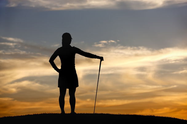 golfozó a naplementét néz ki, a nézet. - Fotó, kép