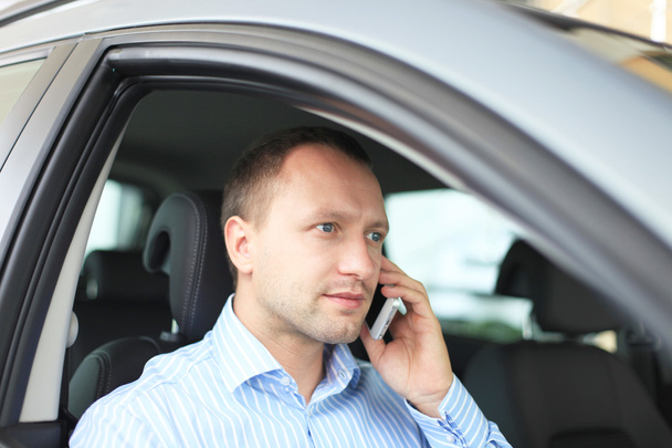 Portrait of business man inside the car - Photo, Image