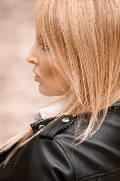 young beautiful  woman in leather jacket  - Φωτογραφία, εικόνα