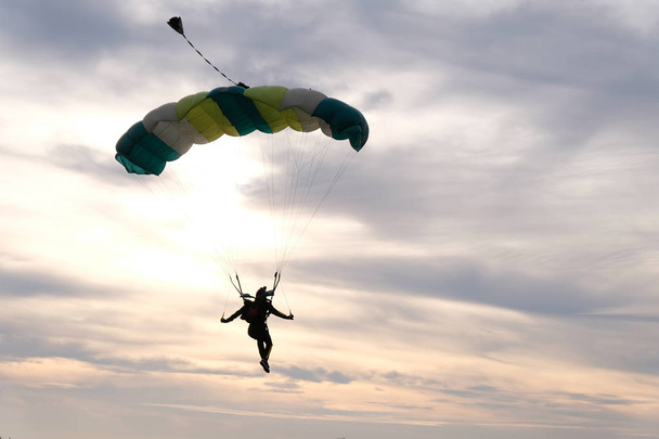 Skydiving. A parachute is in the beautiful sky. - Photo, Image