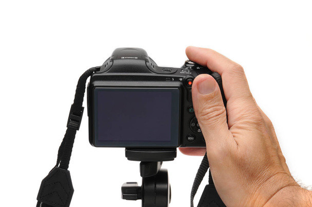 Цифровая фотокамера на белом фоне
 - Фото, изображение