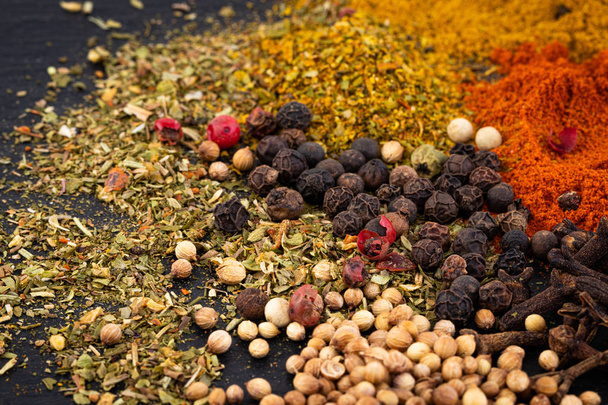 Colourful various  spices on dark background. - Foto, imagen