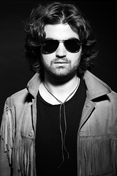 Black and white portrait of rock style musician. Wearing sunglas - Photo, Image