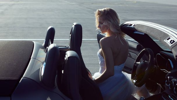 Fashion portrait of dreamy woman in the luxury car. No retouch. - Photo, image