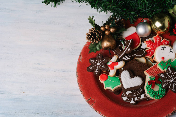 Close up of plate with colorful christmas cookies  - Foto, afbeelding