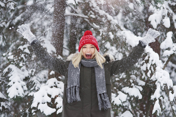 Young woman covered with fresh snow - Фото, изображение