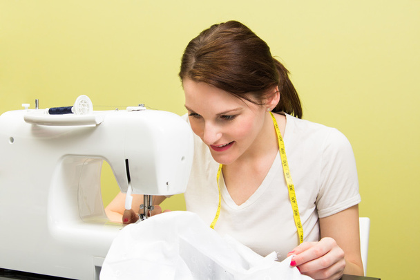 Brunette woman sewing - Photo, Image