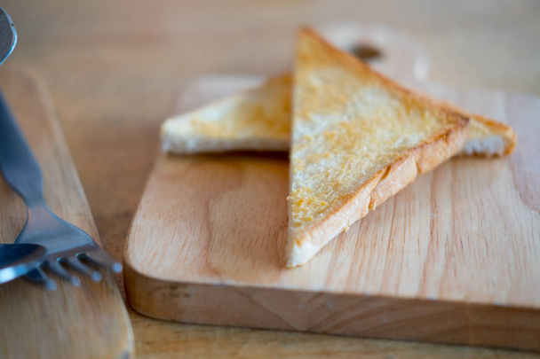 Toast or bread with butter triangular  - Zdjęcie, obraz