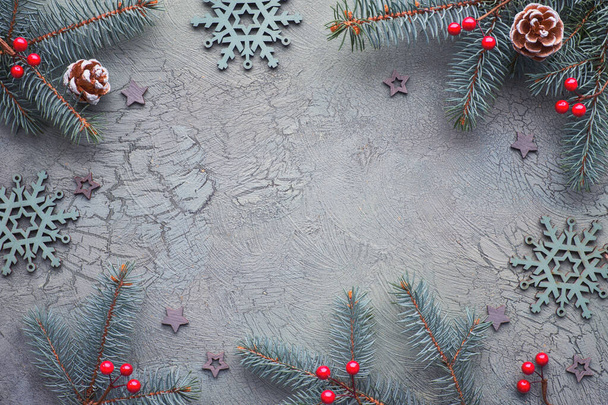 Flat lay with decorated fir twigs on dark textured background in - Фото, изображение