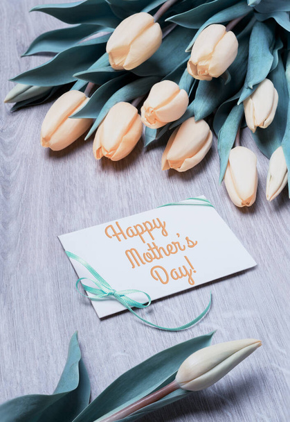 Greeting card "Happy Mother's Day" with bunch of tulips - Фото, изображение