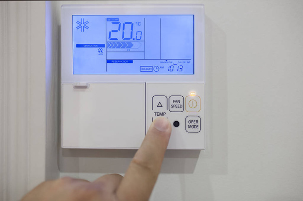 Adjusting room climate control with electronic device at home - Photo, Image