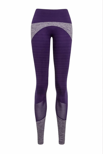 Фиолетовые спортивные леггинсы выделены на белом фоне. Концепция стильной одежды, спорта, красоты, моды и стройных ног. Фотография манекена призрака
 - Фото, изображение