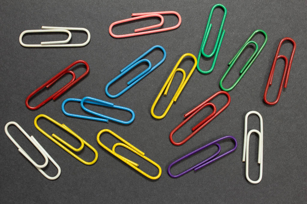 View of paperclips over a black colour background - Photo, Image