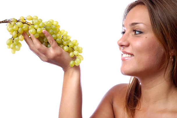 Hungry girl wants to eat delicious juicy grapes - Foto, Imagen