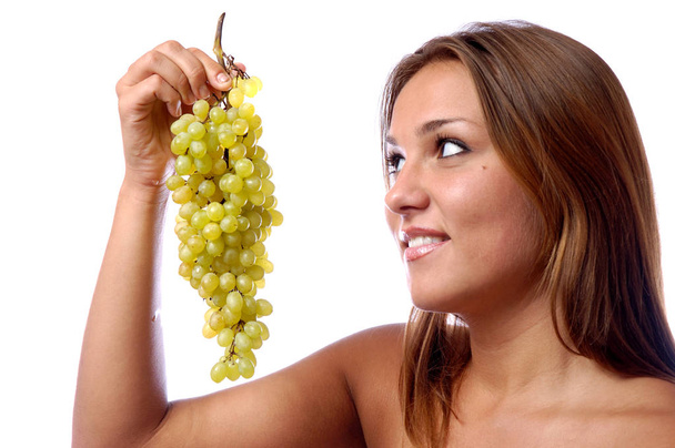 Chica hambrienta quiere comer deliciosas uvas jugosas
 - Foto, Imagen