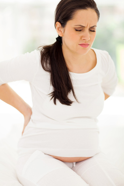 pregnant woman having back pain - Fotó, kép