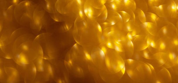 Gold glitter bokeh lights festive background - Foto, Imagen