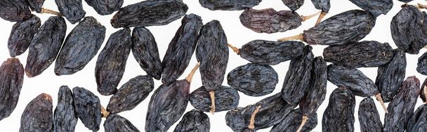 top view of black raisins isolated on white, panoramic shot - Photo, Image
