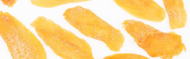 close up view of dried mango slices isolated on white, panoramic shot - Photo, Image