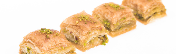 traditional turkish honey baklava with nuts isolated on white, panoramic shot - Foto, immagini