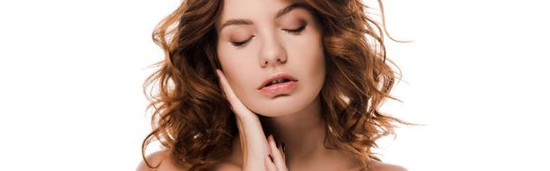 panoramic shot of beautiful young woman with closed eyes touching face isolated on white  - Фото, зображення