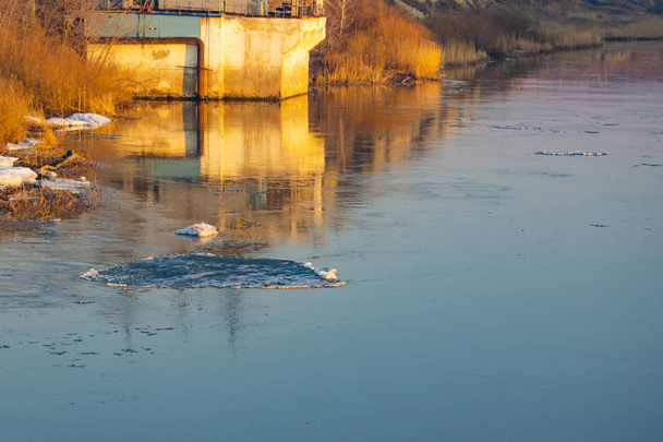 spring ice drift on the river in muddy water before high water a - Photo, Image