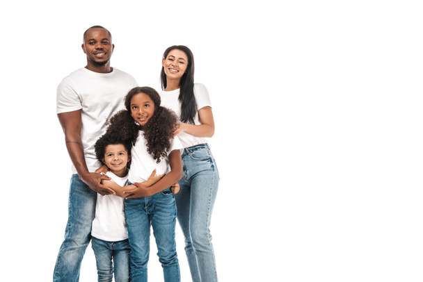 happy african american parents with daughter and son smiling at camera while standing isolated on white - Zdjęcie, obraz
