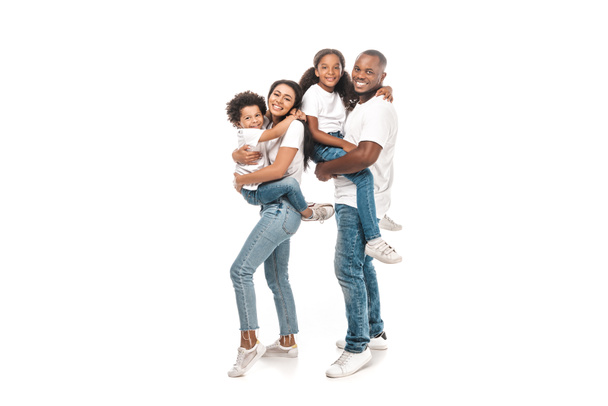 happy african american woman holding son, and husband holding daughter on white background - Fotoğraf, Görsel