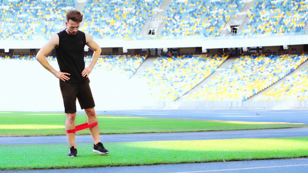 sportsman exercising with resistance band - Video