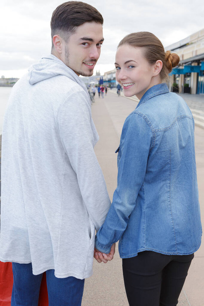 young couple wandering in the city - Фото, зображення