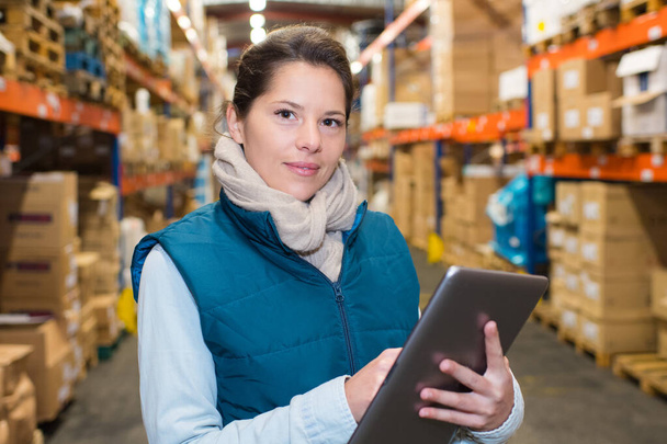 businesswoman using tablet in warehouse - Photo, image