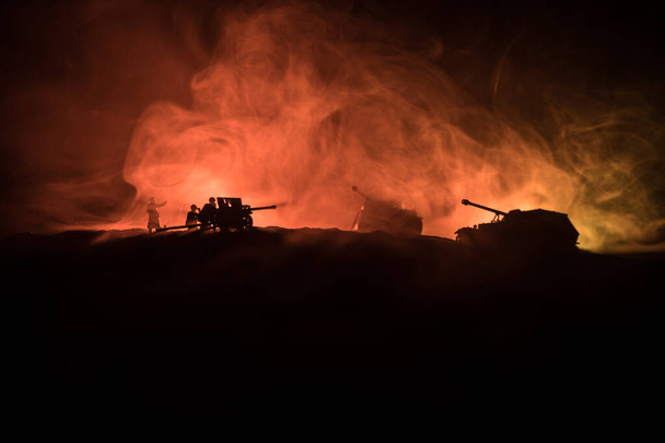 War Concept. Military silhouettes fighting scene on war fog sky background, World War German Tanks Silhouettes Below Cloudy Skyline At night. Attack scene. Armored vehicles and infantry. - Fotografie, Obrázek