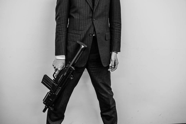Businessman to fight with a machine gun - Photo, Image