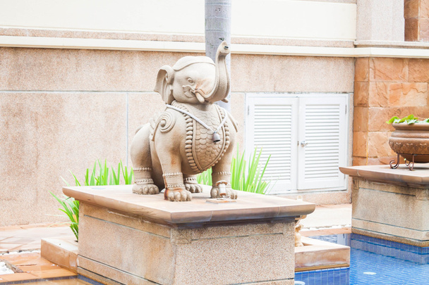 Elephant statue decorated beside tropical swimming pool - Photo, Image